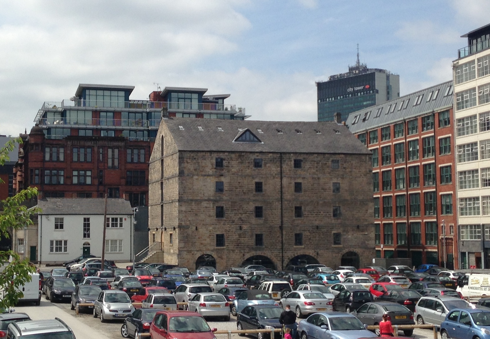 The old stone warehouse all at sea in a car park rather than in water
